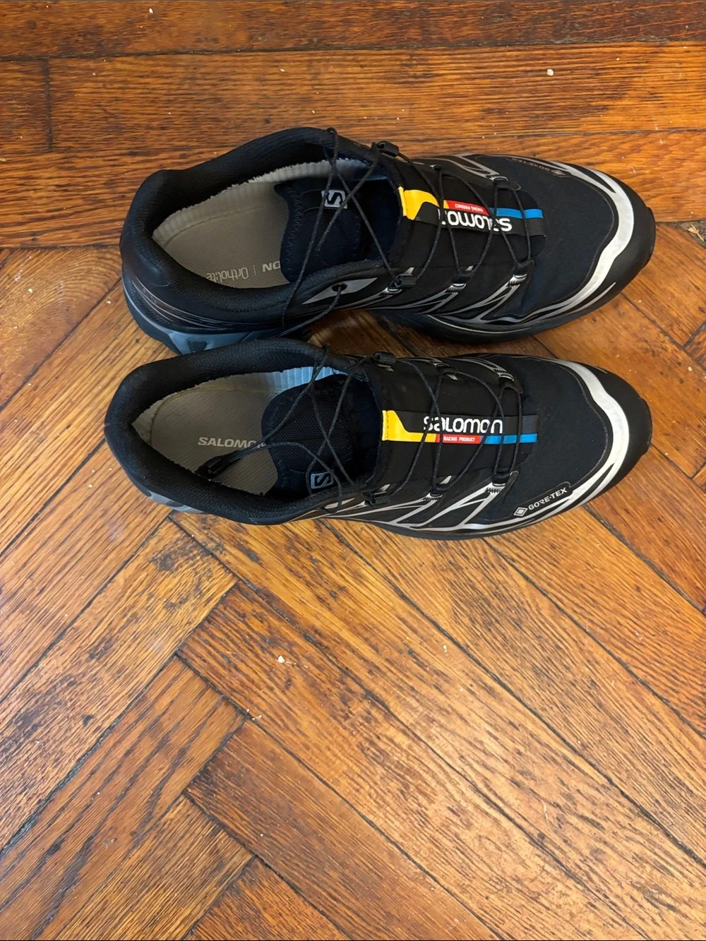 Salomon Men’s Black Athletic Shoes with Yellow & Blue Accents